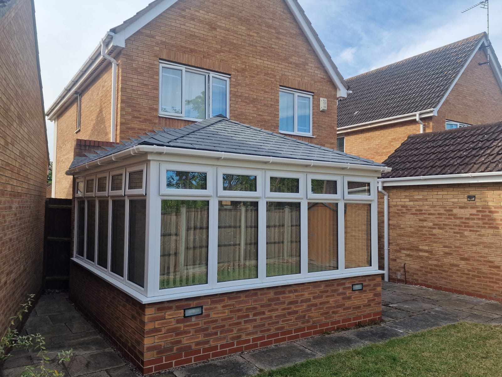 White Frames Grey Tiled Conservatory Roof