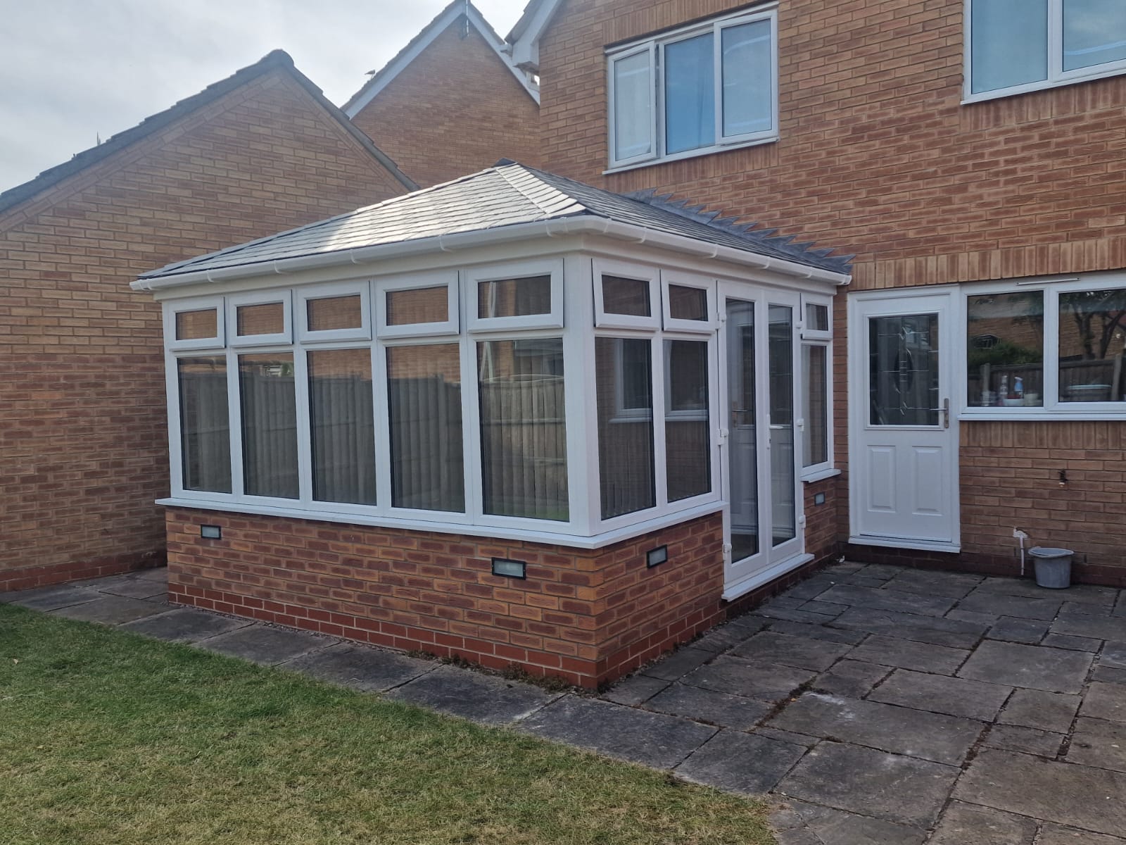 White Frames Grey Tiled Conservatory Roof